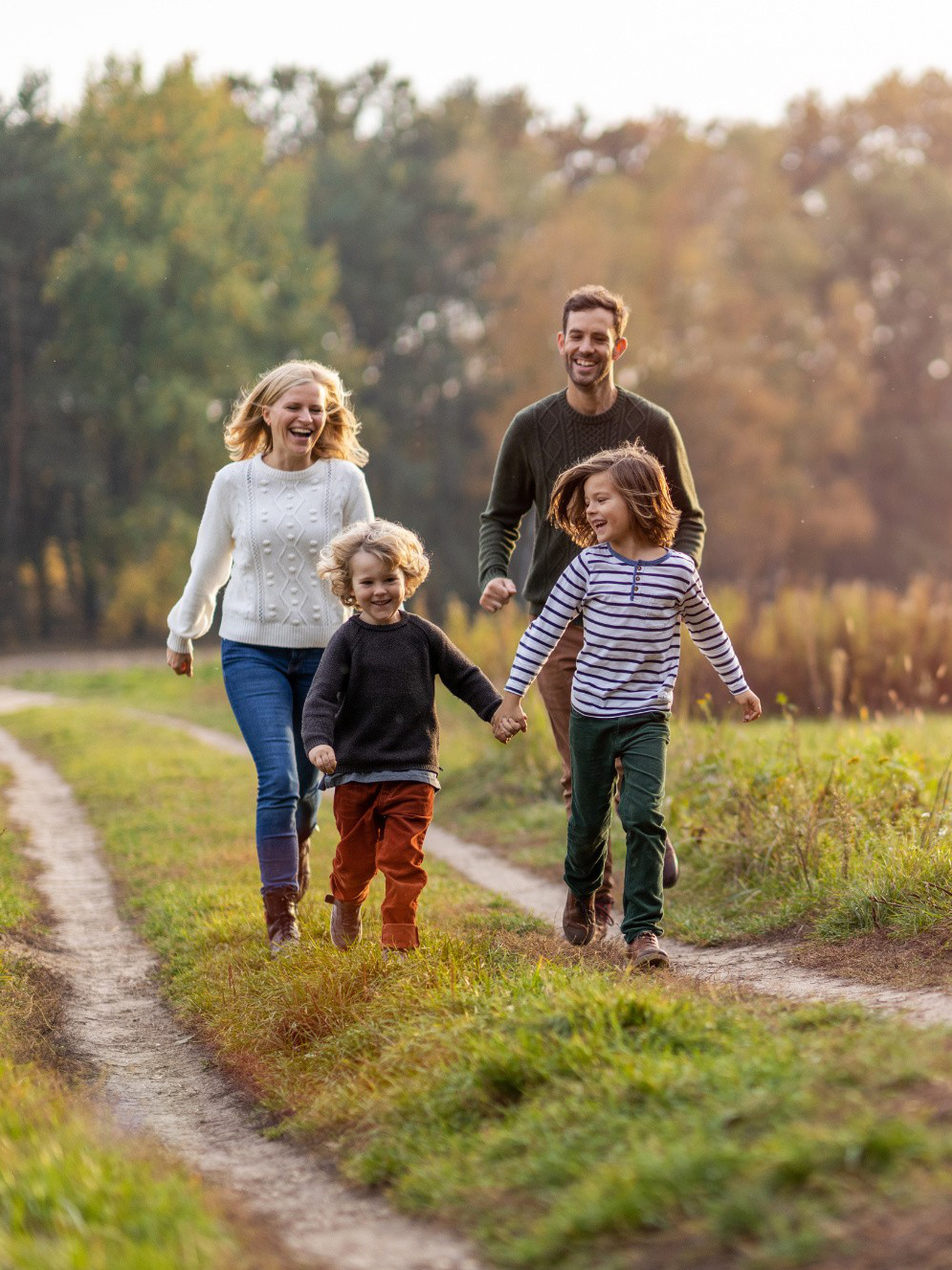 Family running in field